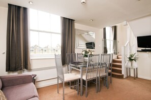 Family Apartment sleeps 6 | Living area | Flat-screen TV