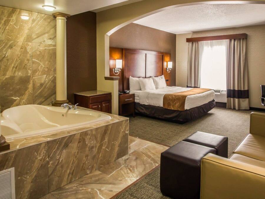 Suite, Non-Smoking, 1 King Bed with Sofa Bed and Jacuzzi | In-room safe, desk, iron/ironing board, free cribs/infant beds