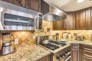 Room, 4 Bedrooms (Residence) | Private kitchen | Fridge, microwave, coffee/tea maker, highchair