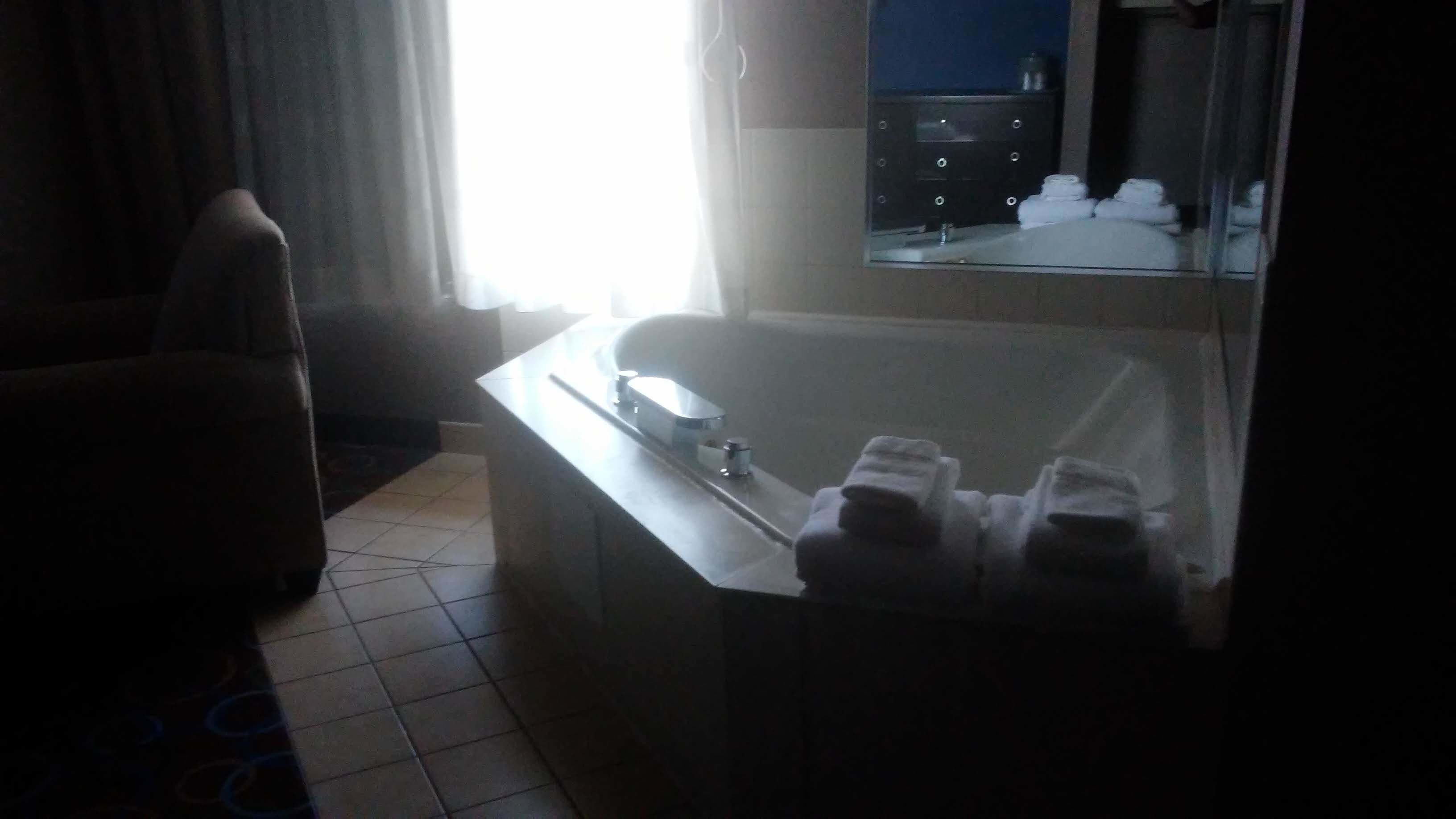 suite, 1 king bed, jetted tub | 1 bedroom, desk, blackout curtains, iron/ironing board