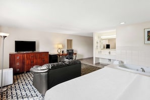 Suite, 1 King Bed with Sofa bed, Non Smoking, Jetted Tub (with Sofabed) | Laptop workspace, blackout drapes, iron/ironing board