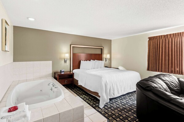 Suite, 1 King Bed with Sofa bed, Non Smoking, Jetted Tub (with Sofabed) | Laptop workspace, blackout drapes, iron/ironing board
