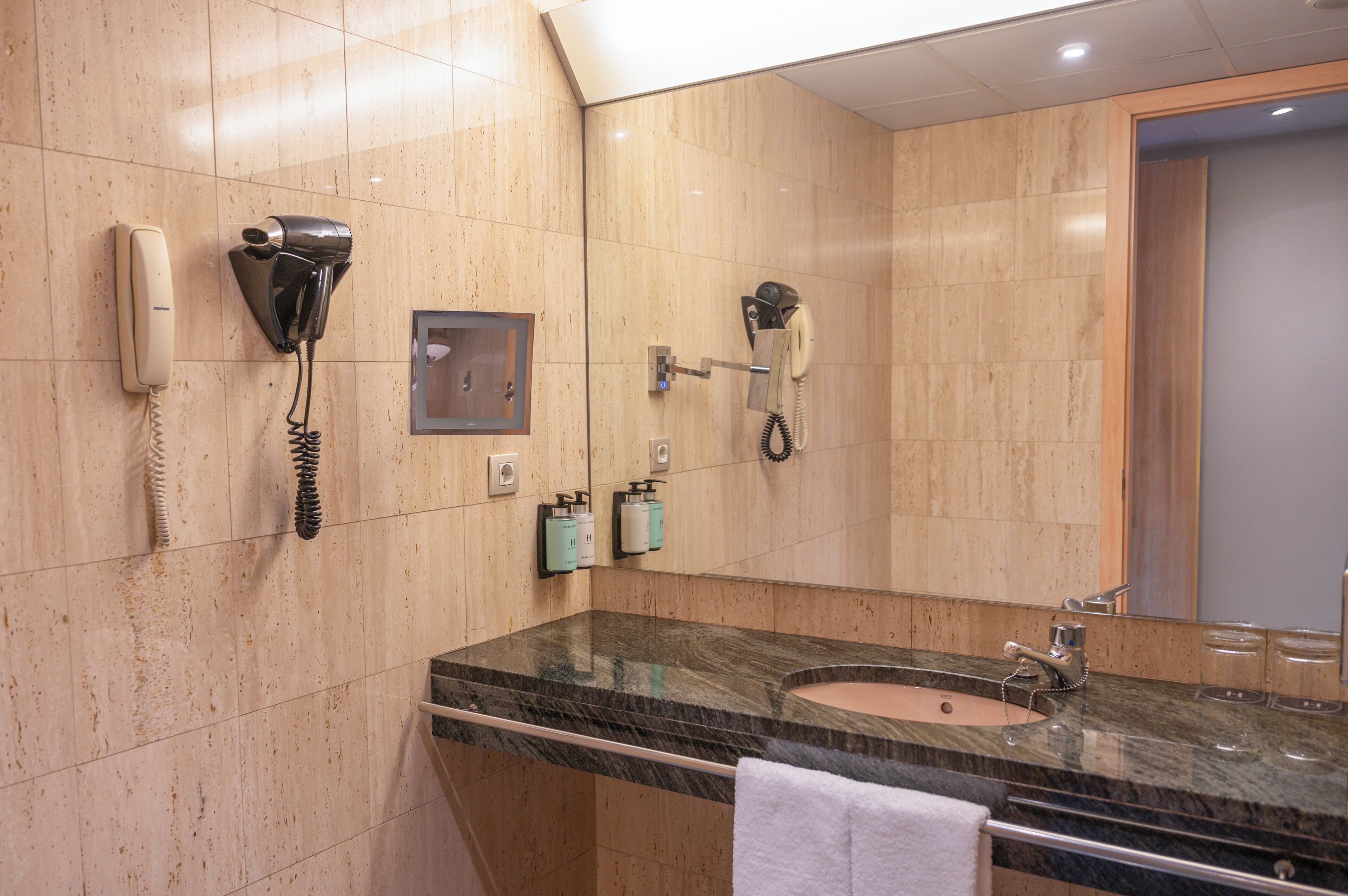 junior suite | bathroom | bathtub, free toiletries, hair dryer, towels