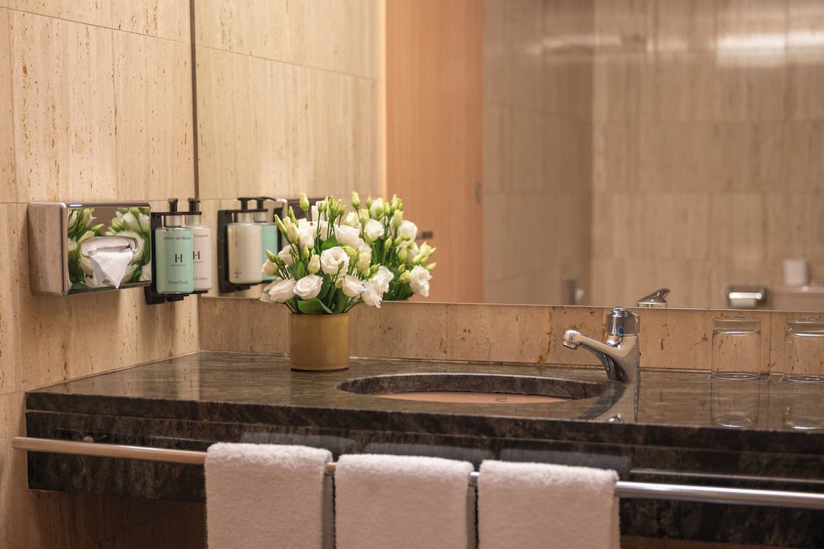 bathtub, free toiletries, hair dryer, towels