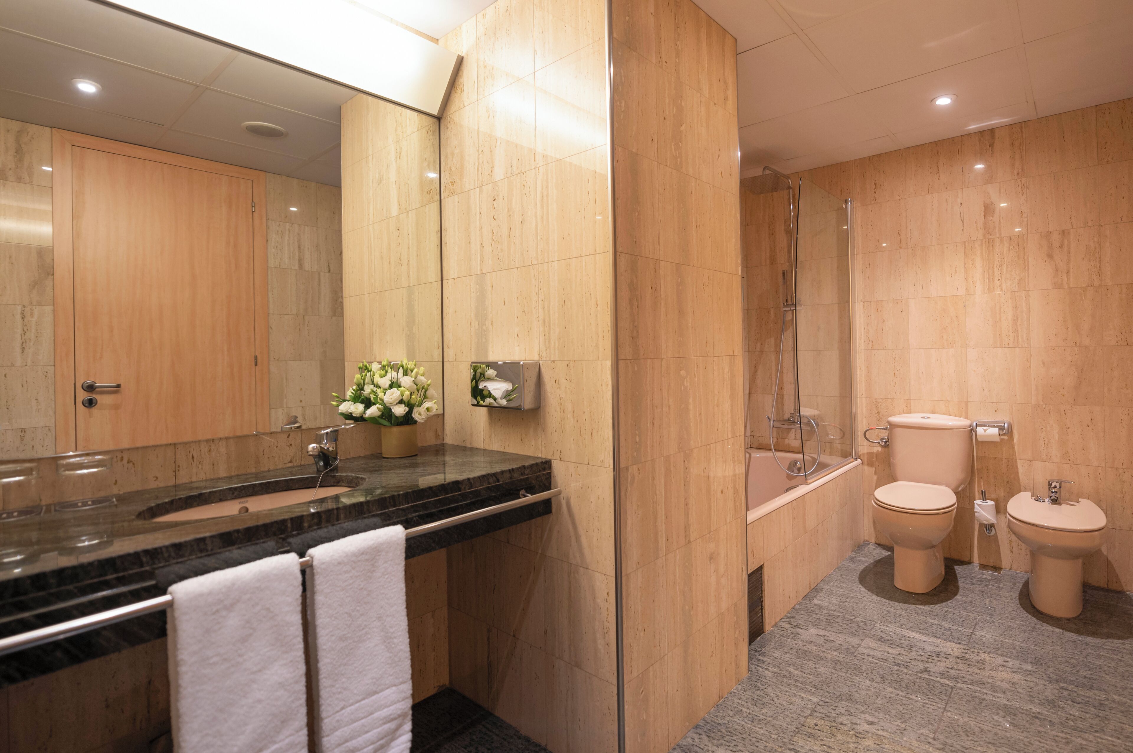 bathtub, free toiletries, hair dryer, towels