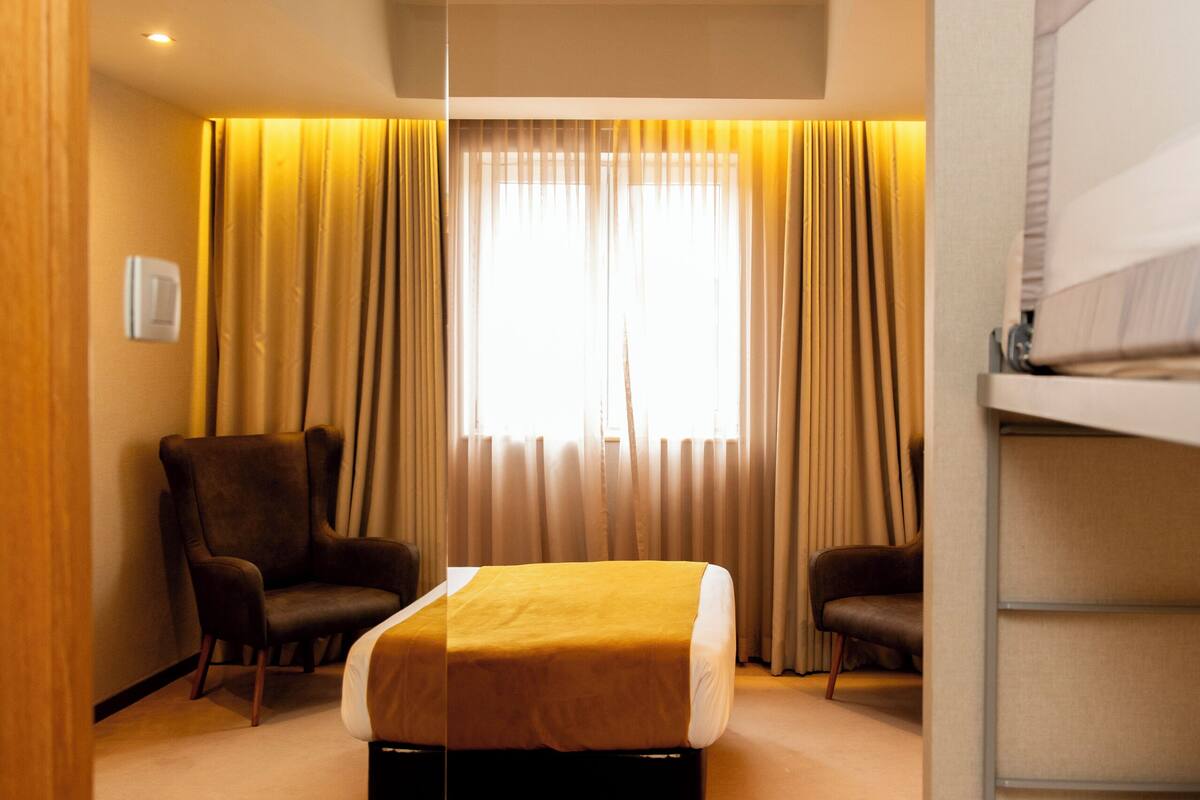 Desk, blackout curtains, free WiFi, bed sheets