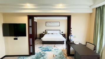 Business Suite | Premium bedding, in-room safe, individually decorated, desk