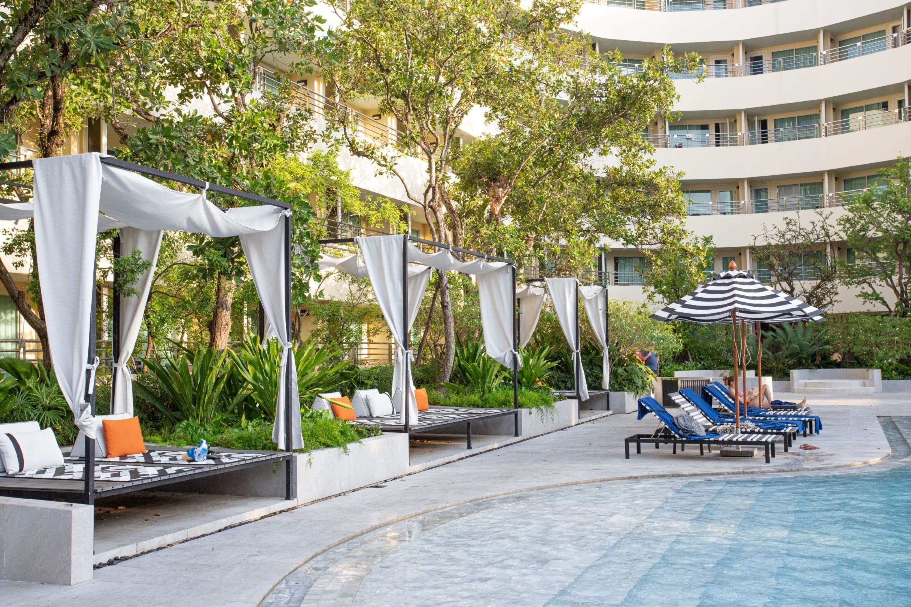 Outdoor pool, open 7:00 AM to 7:00 PM, free pool cabanas, pool umbrellas