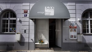 A vintage design hotel entrance with a sign reading "sax vintage design hotel". - LH Vintage Design Hotel Sax (Prague)