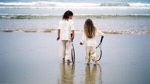 On the beach, white sand, beach towels
