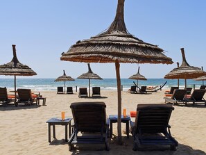 On the beach, white sand, beach towels
