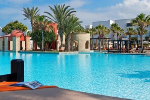 Outdoor pool, free cabanas, pool umbrellas