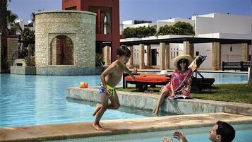 Outdoor pool, free pool cabanas, pool umbrellas