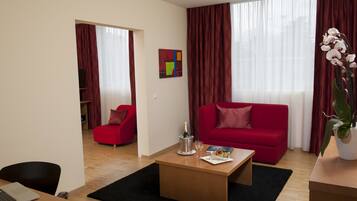 Suite, 1 King Bed with Sofa bed, Non Smoking (2 Rooms) | In-room safe, desk, blackout drapes, soundproofing