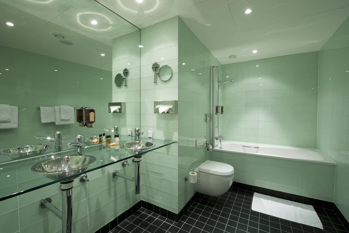 suite, 1 king bed with sofa bed, non smoking (2 rooms) | bathroom | shower, free toiletries, hair dryer, towels