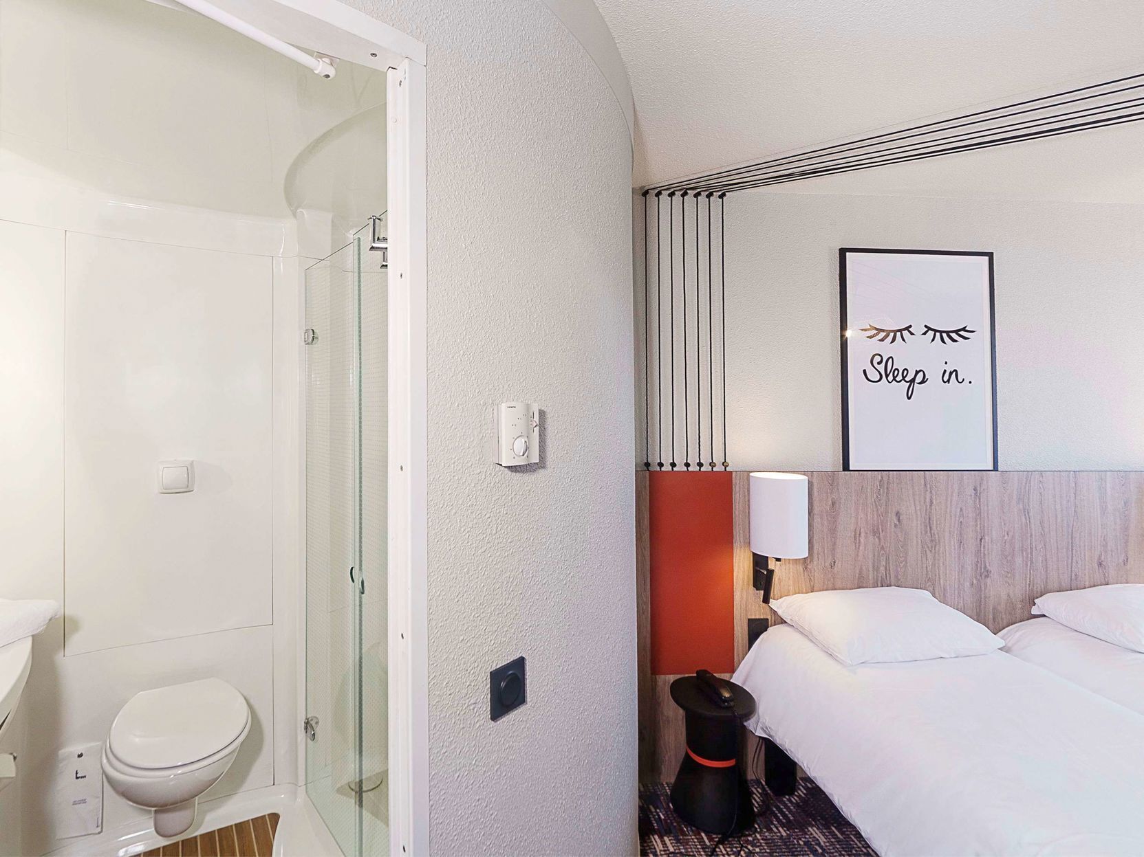 Premium bedding, pillow-top beds, blackout curtains, iron/ironing board