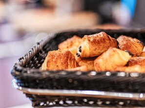 A basket filled with assorted pastries.