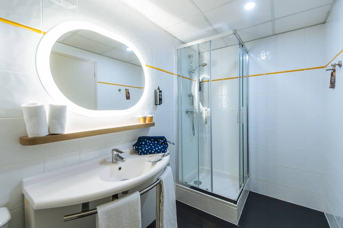 shower, eco-friendly toiletries, towels