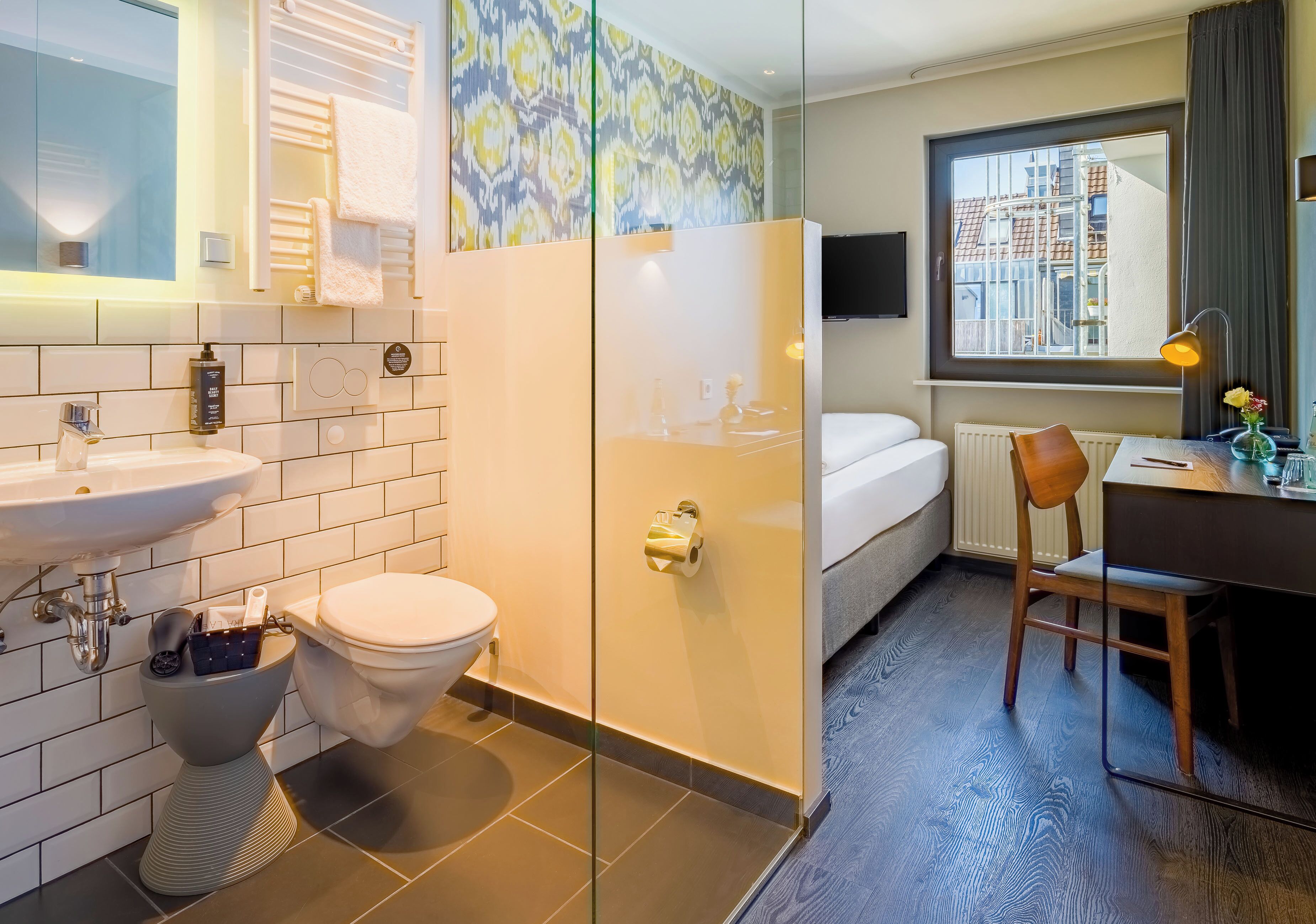 eco-friendly toiletries, hair dryer, towels