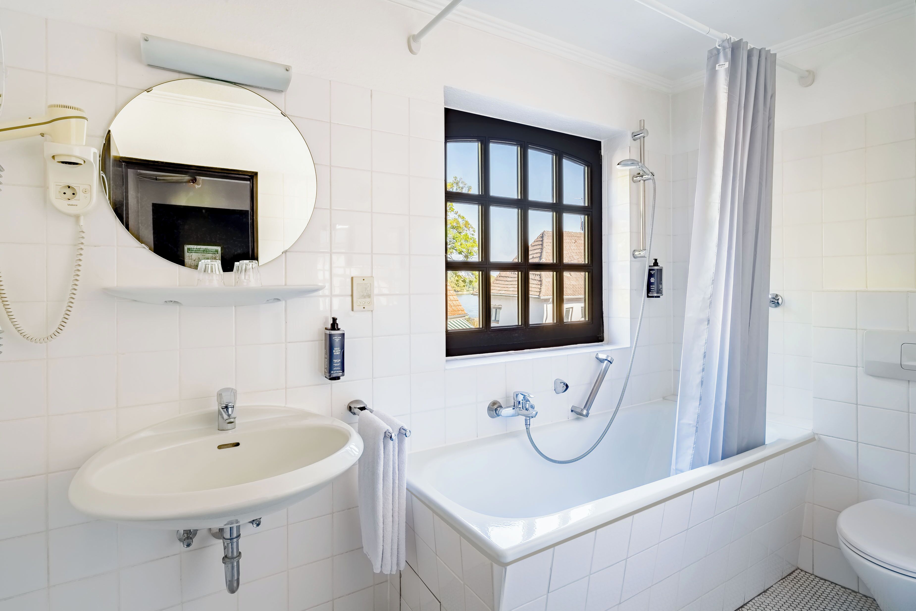 standard double room | bathroom | eco-friendly toiletries, hair dryer, towels
