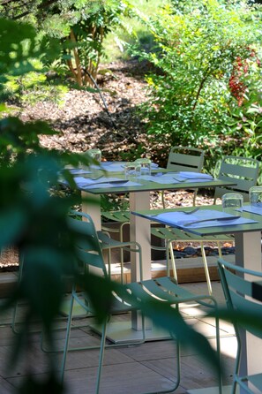 Dinner served, French cuisine, garden views 