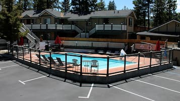 Seasonal outdoor pool, open 9:00 AM to 9:00 PM, pool umbrellas