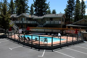 Seasonal outdoor pool, open 9:00 AM to 9:00 PM, pool umbrellas