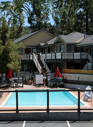Seasonal outdoor pool, open 9:00 AM to 9:00 PM, pool umbrellas
