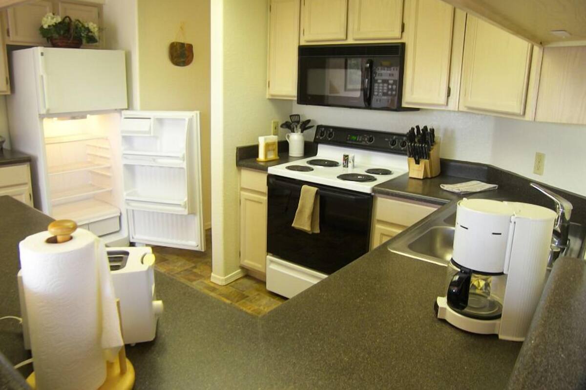 Condo, 1 Bedroom | Private kitchen | Coffee/tea maker, full-sized fridge, microwave, dishwasher