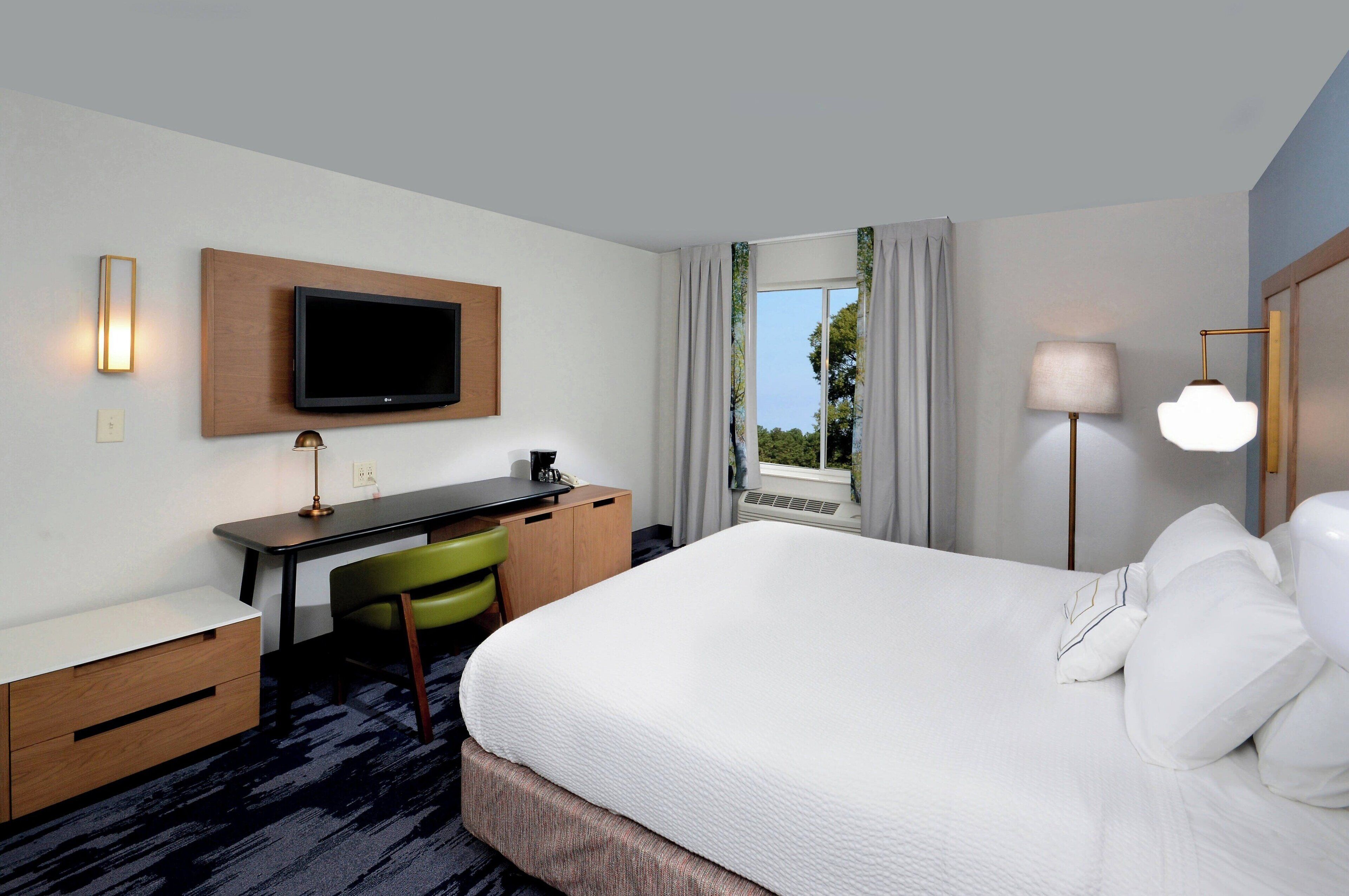 desk, laptop workspace, blackout curtains, iron/ironing board