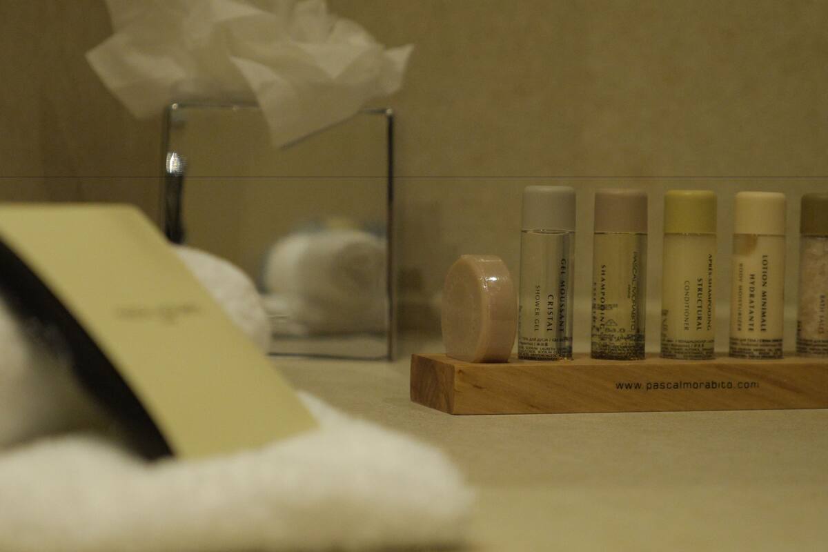 designer toiletries, hair dryer, towels, shampoo