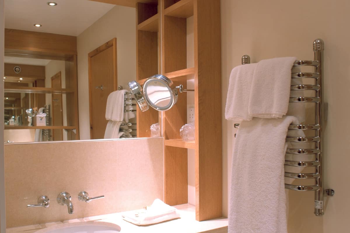 designer toiletries, hair dryer, towels, shampoo