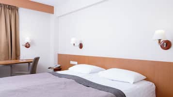 Habitación individual estándar | Ropa de cama hipoalergénica, minibar, escritorio y cortinas opacas