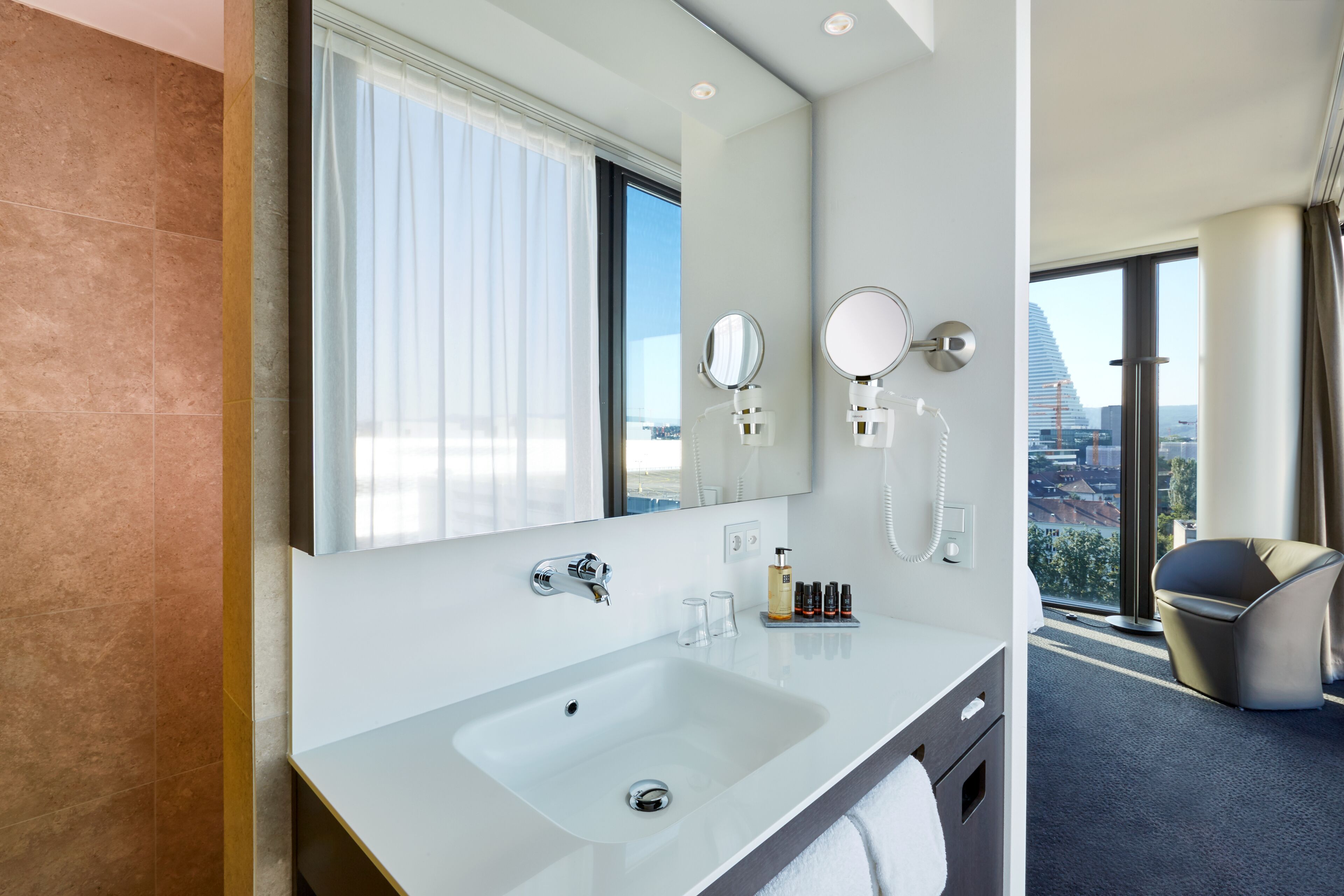 shower, rainfall showerhead, hair dryer, towels