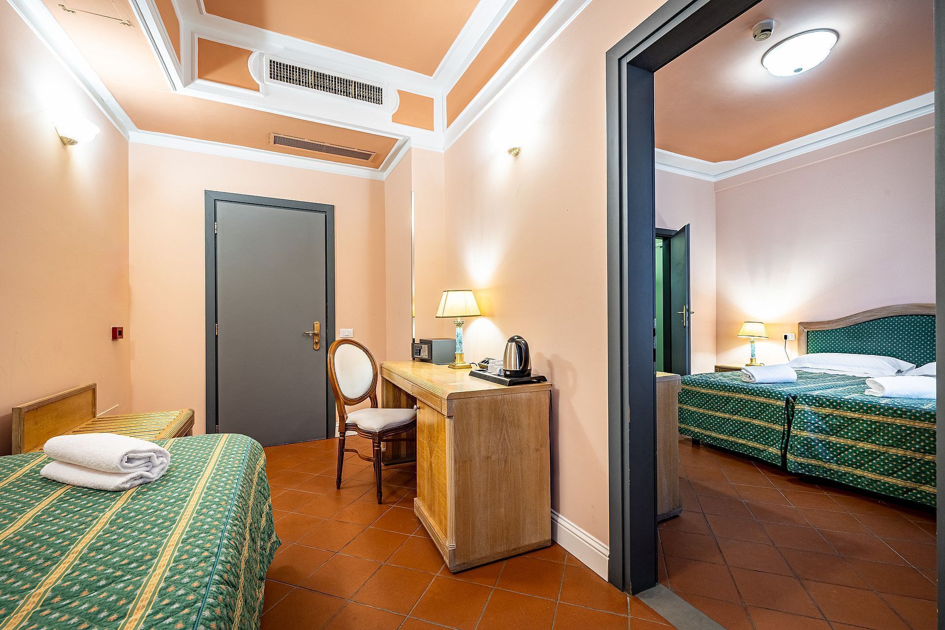 Family Triple Room | Minibar, in-room safe, desk, blackout curtains
