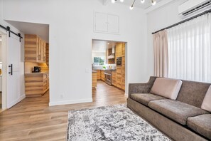 Suite, 1 Bedroom | Living area | 35-inch flat-screen TV with cable channels, TV