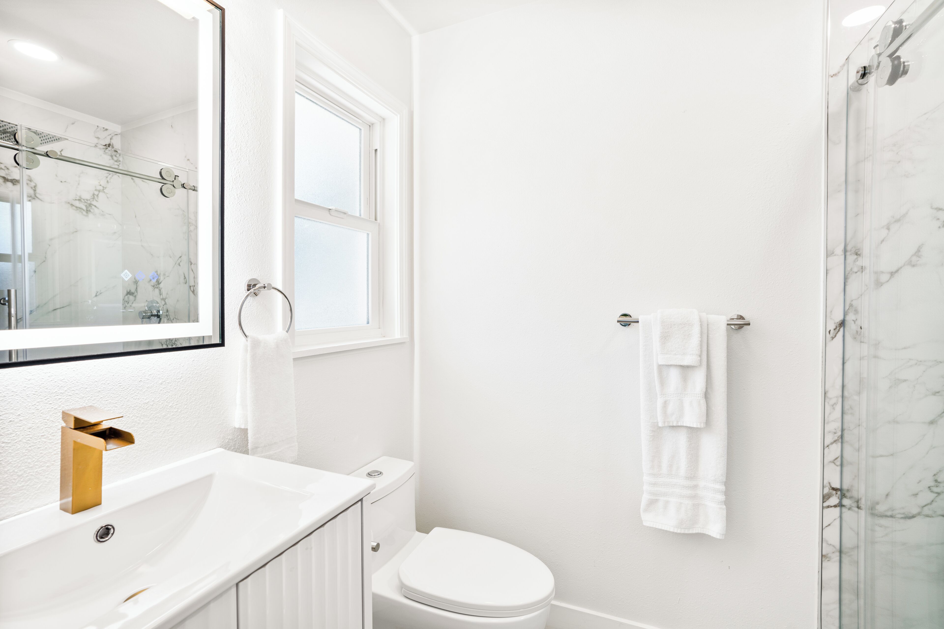 room, 2 queen beds | bathroom | shower, hydromassage showerhead, hair dryer, towels