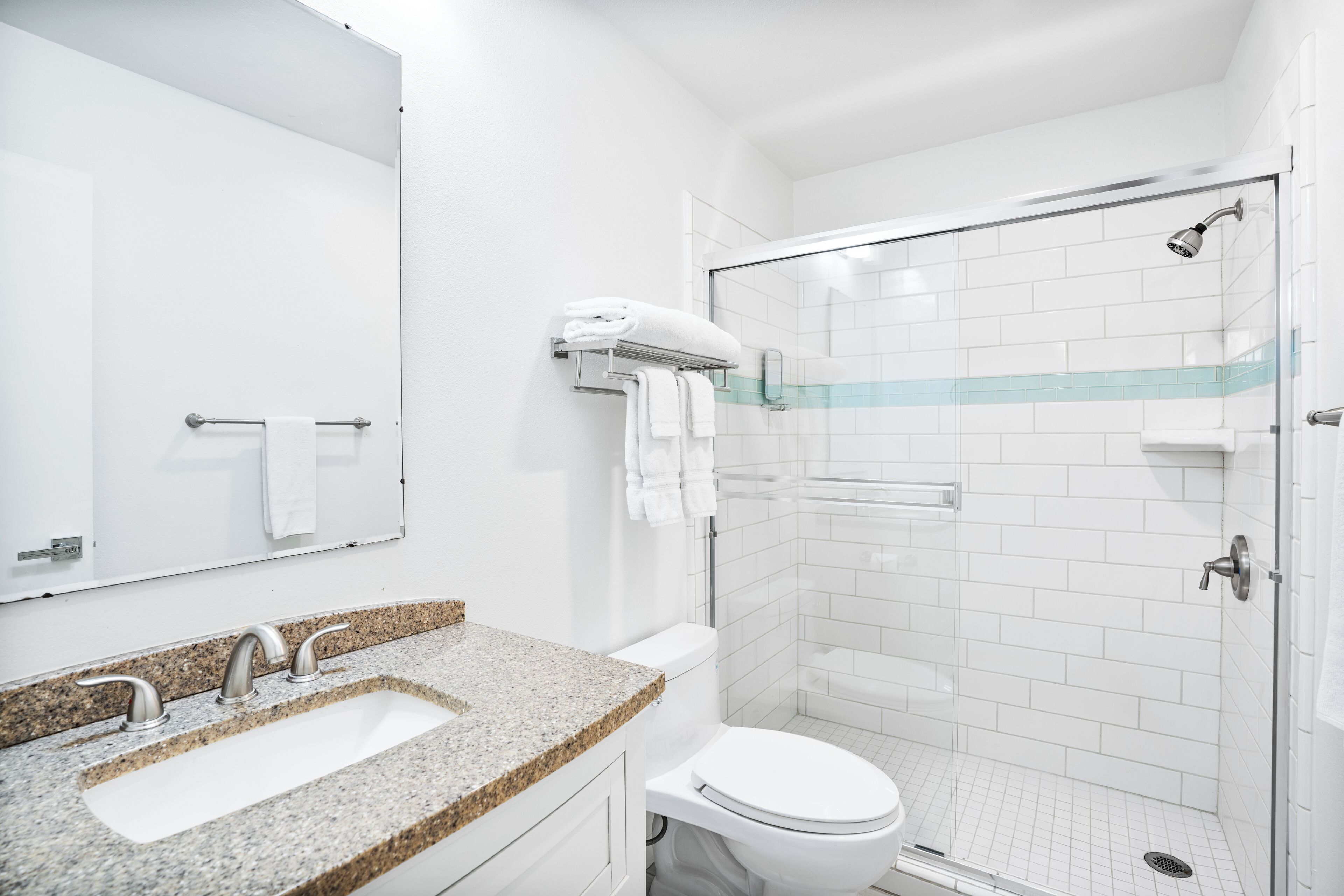 room, 2 queen beds | bathroom | shower, hydromassage showerhead, hair dryer, towels