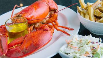 Lunch, dinner served; local cuisine, sea views
