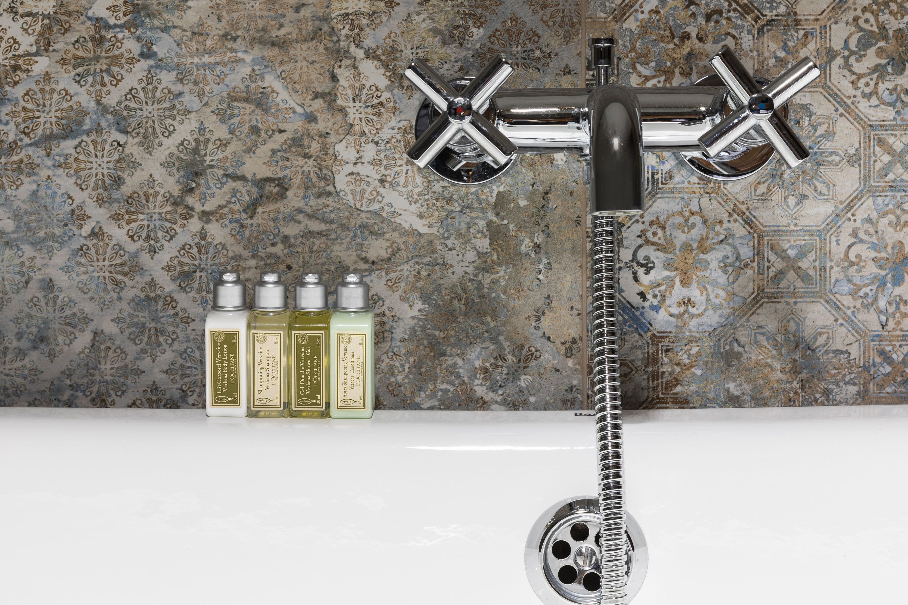 combined shower/bathtub, deep-soaking bathtub, designer toiletries