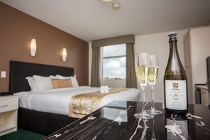 King room with Spa | Living area | 86-cm LCD TV with digital channels, TV