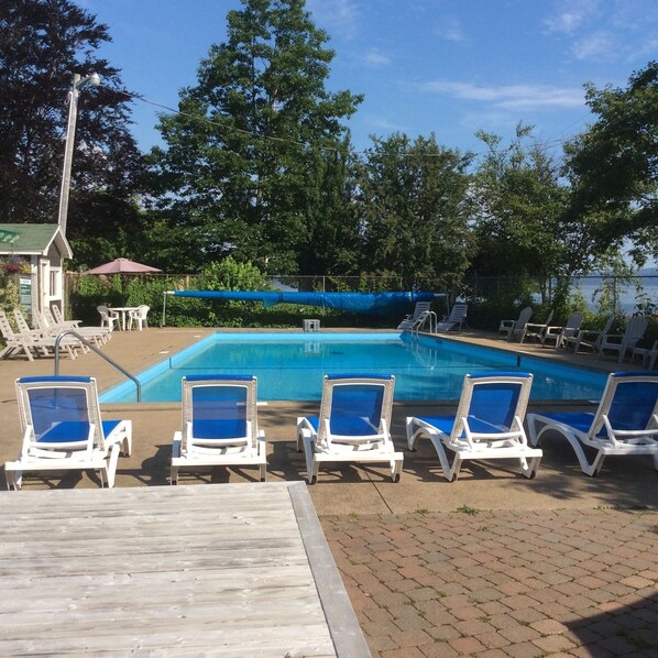 Seasonal outdoor pool, pool umbrellas, pool loungers