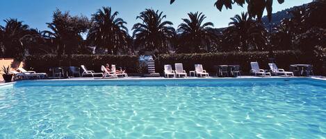 Seasonal outdoor pool, open 9:00 AM to 7:30 PM, sun loungers