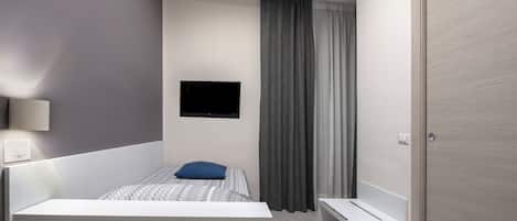 Chambre Simple Supérieure, 1 lit une place | Coffres-forts dans les chambres, bureau, rideaux occultants