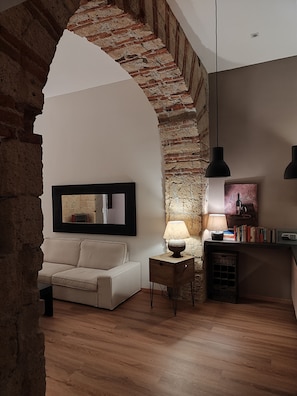 Deluxe Apartment | Living area | 20-inch flat-screen TV with digital channels, TV