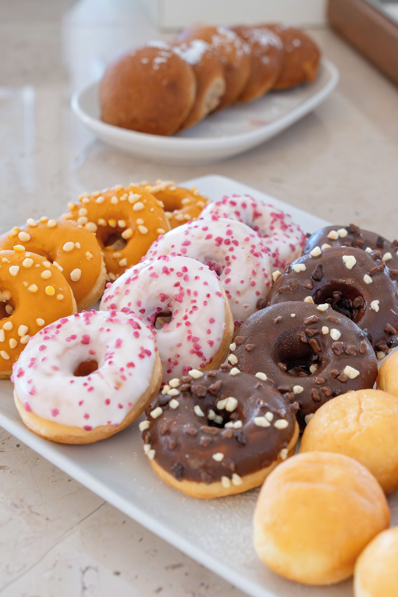 A variety of donuts on a plate.
