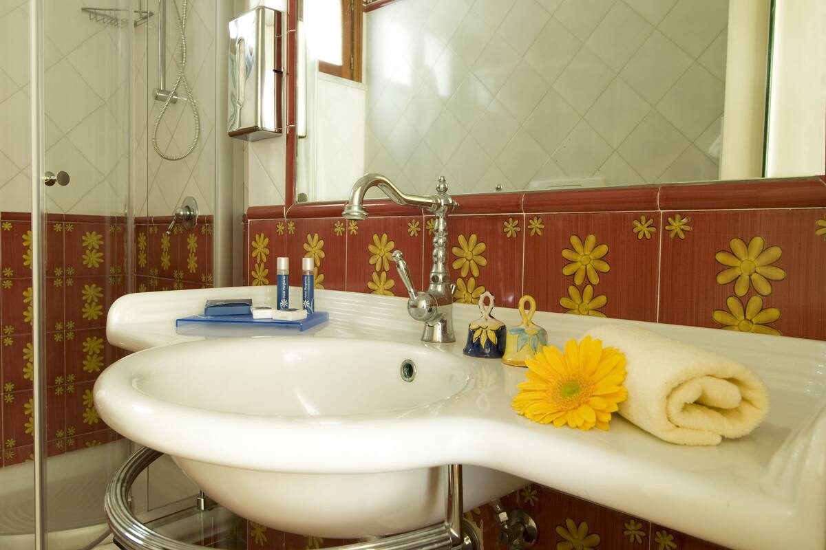 rainfall showerhead, eco-friendly toiletries, hair dryer, bathrobes