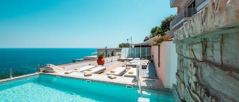 Seasonal outdoor pool, pool umbrellas, sun loungers