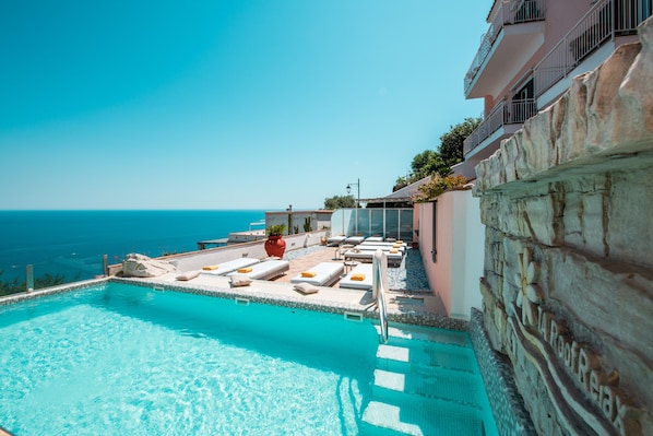 Seasonal outdoor pool, pool umbrellas, sun loungers