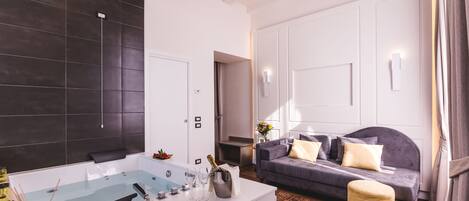 A modern bathroom with a bathtub, a vanity with a mirror, and a shower area.